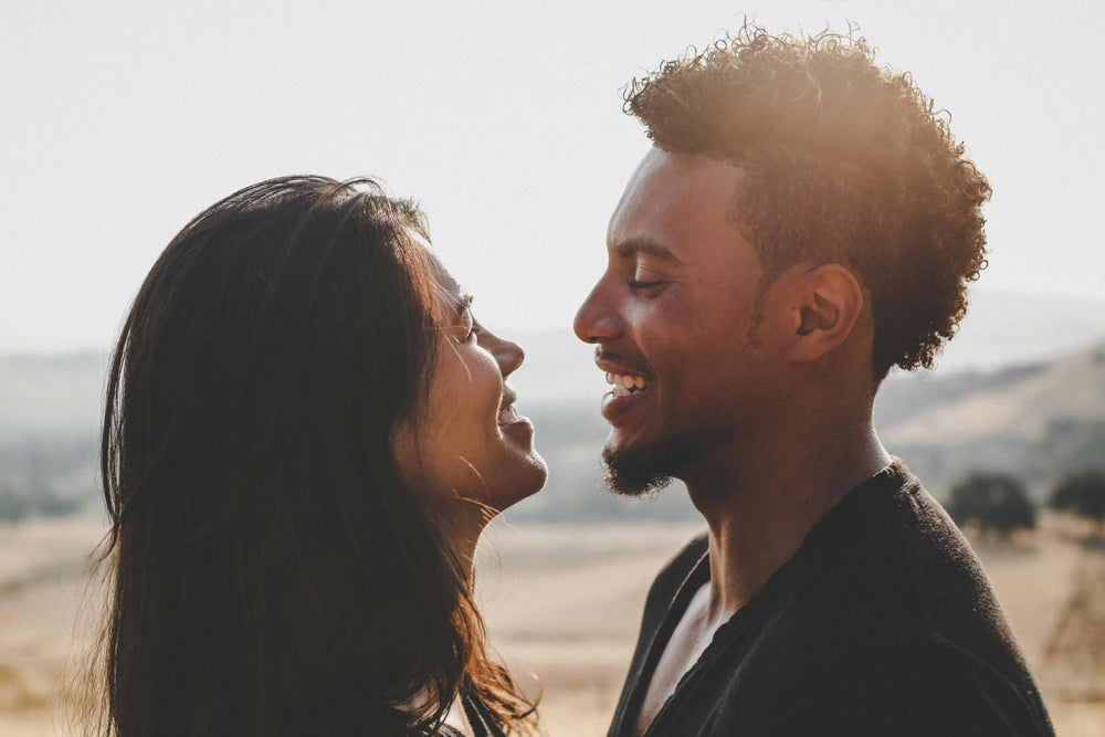 Couple sharing a warm moment outdoors