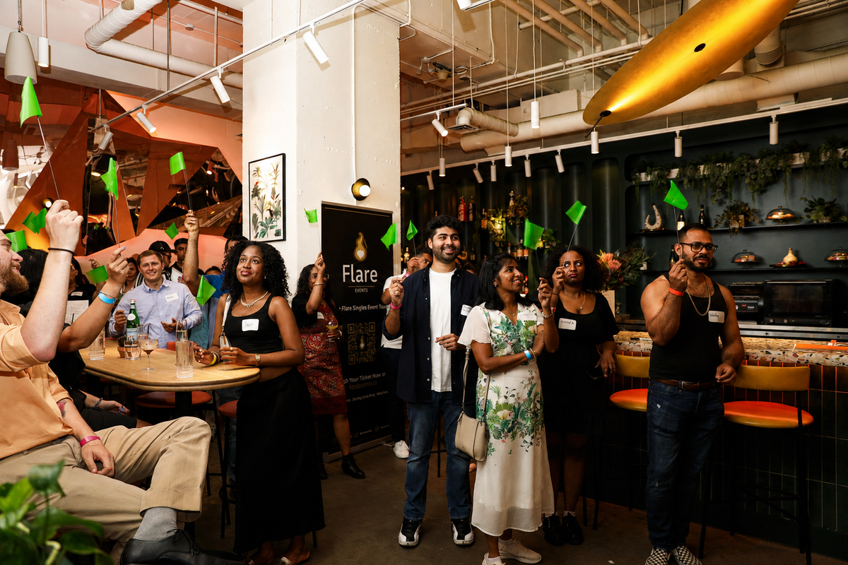 Singles taking part in a lively Flare Events activity at a hosted event
