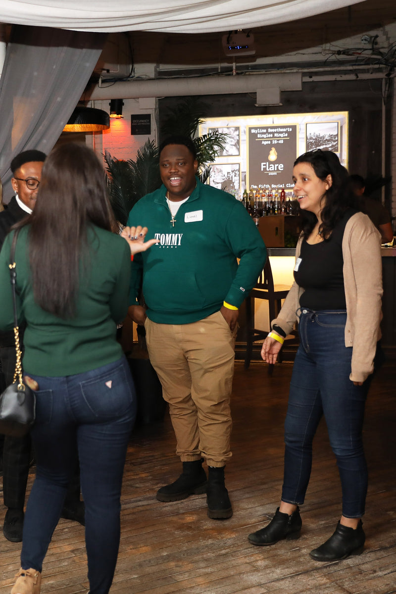 A Flare Events singles event with branded signage